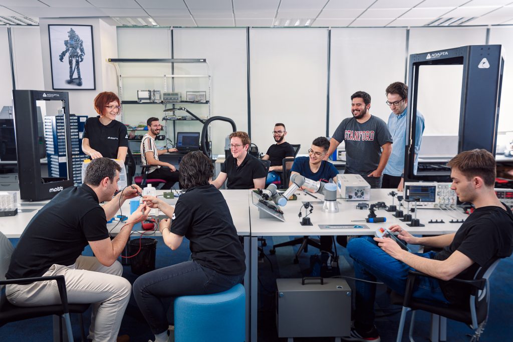 Adapta Robotics team photo inside the lab