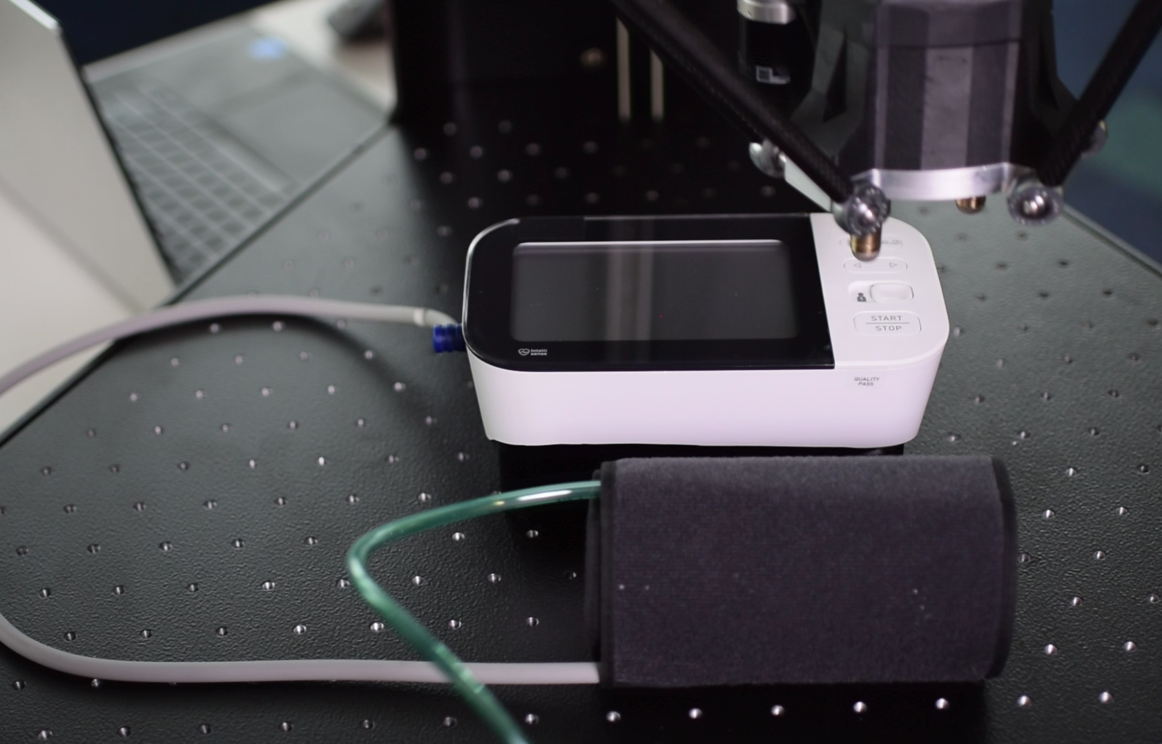 a robot testing a blood monitor pump