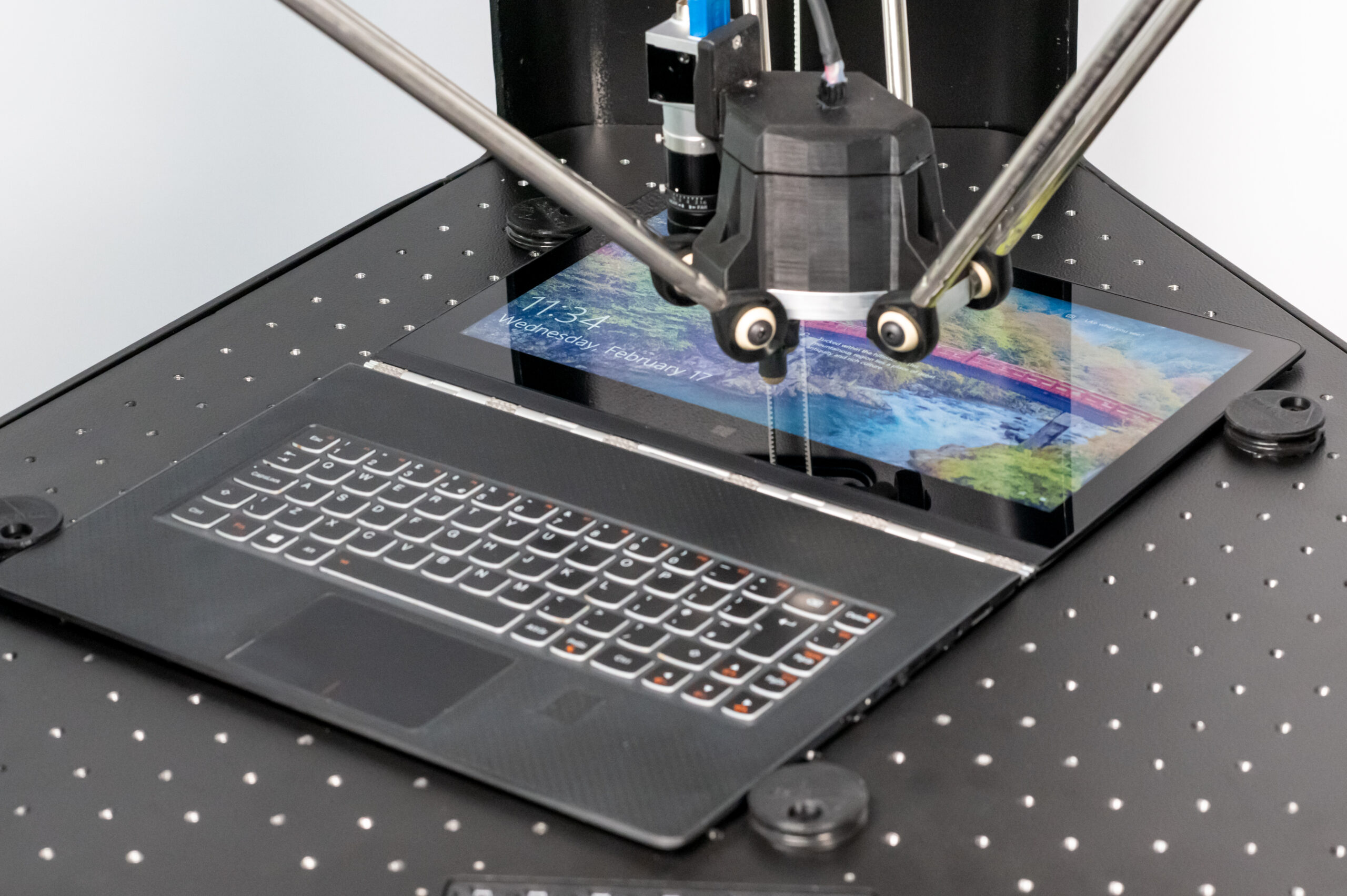 MATT Robot testing the touchscreen and keyboard of a laptop