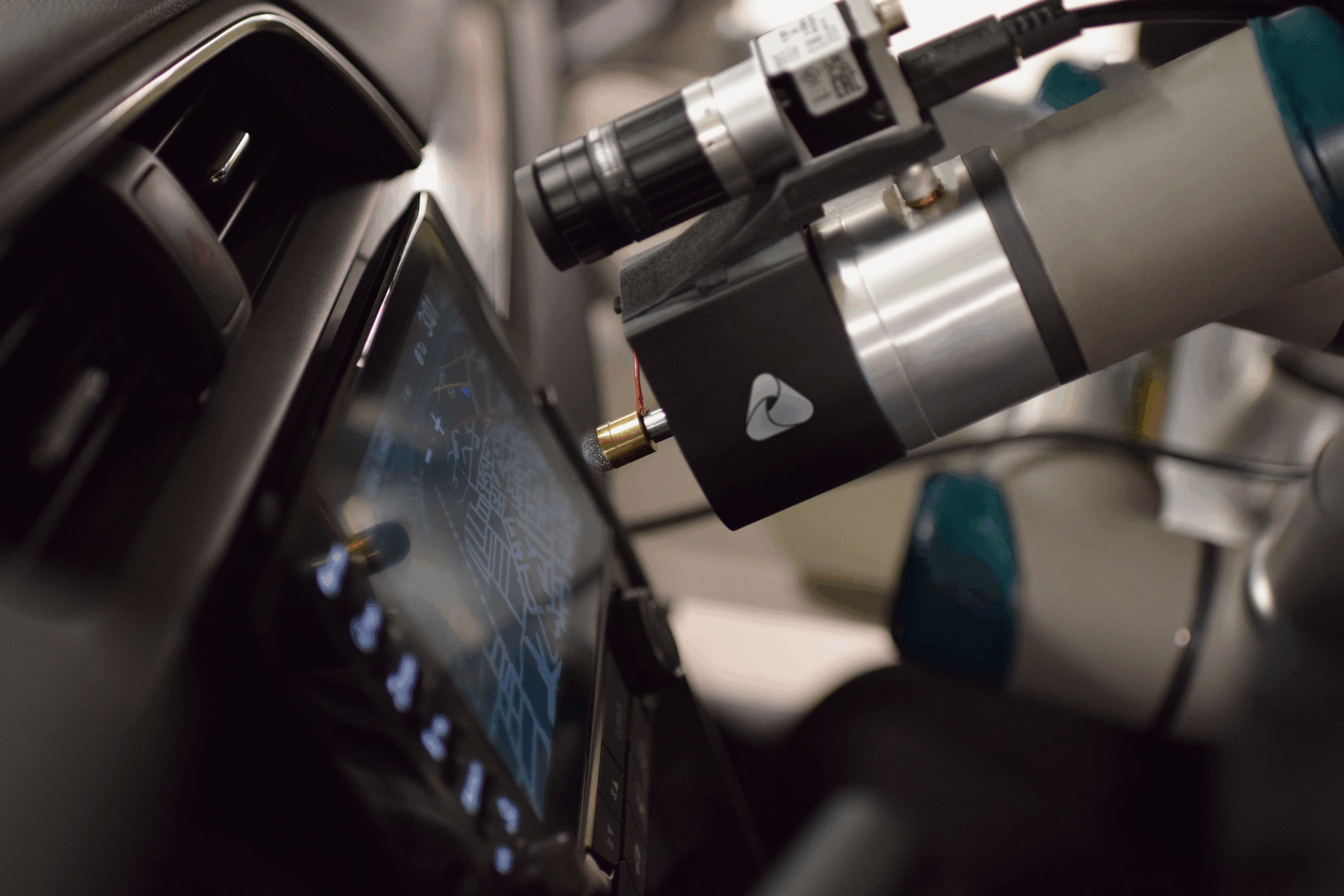 MATT robotic arm testing the IVI system inside a car